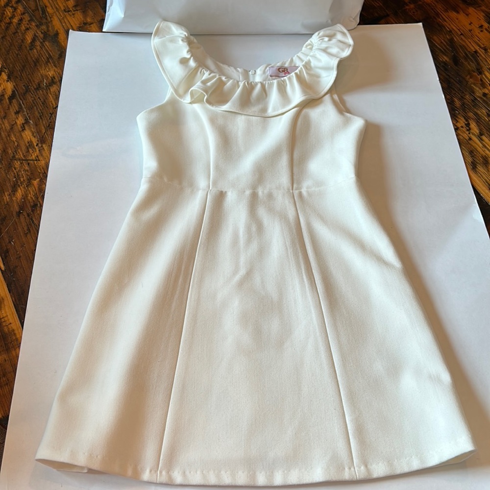 Cream GB girls dress, ruffle neck, sleeveless, zip back. Size 7